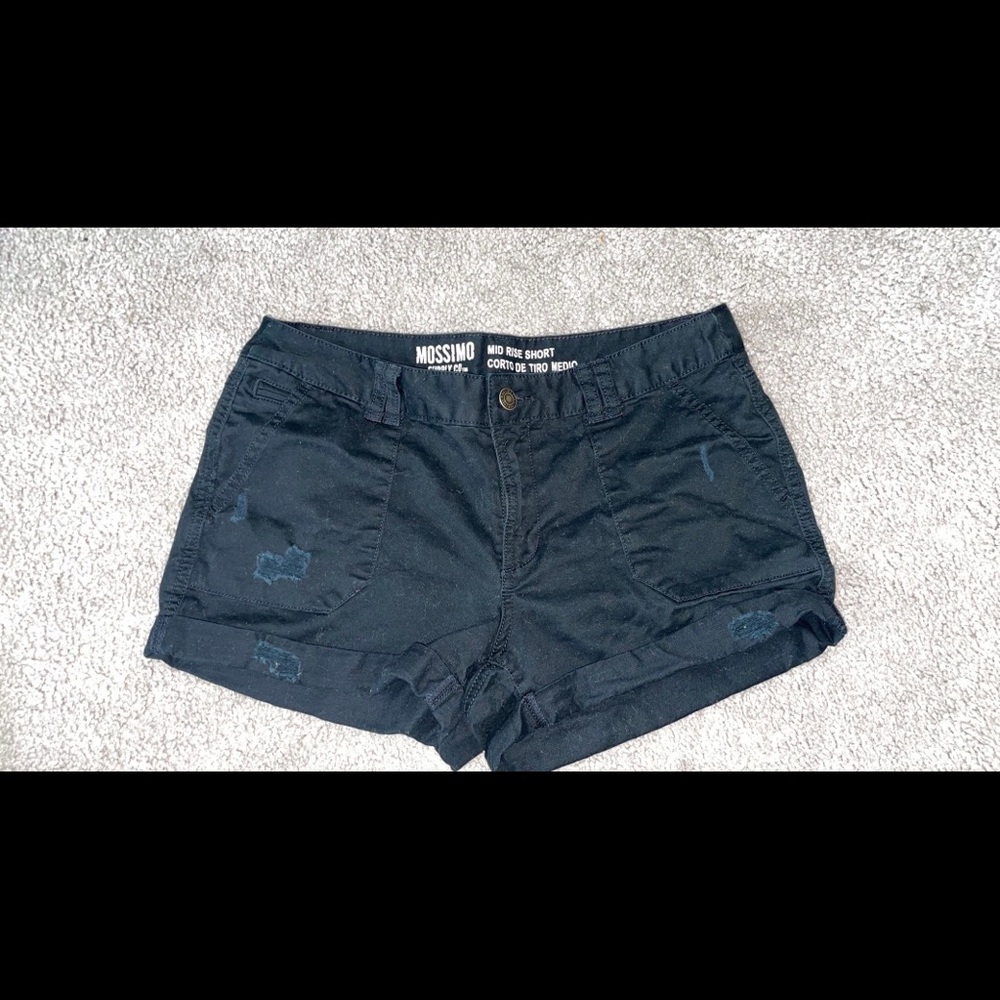 Black distressed mid rise shorts.